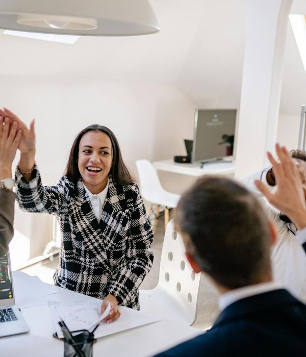 Successful business team celebrating investment portfolio growth results
