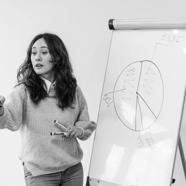 Woman consultant explaining investment strategies with graphs